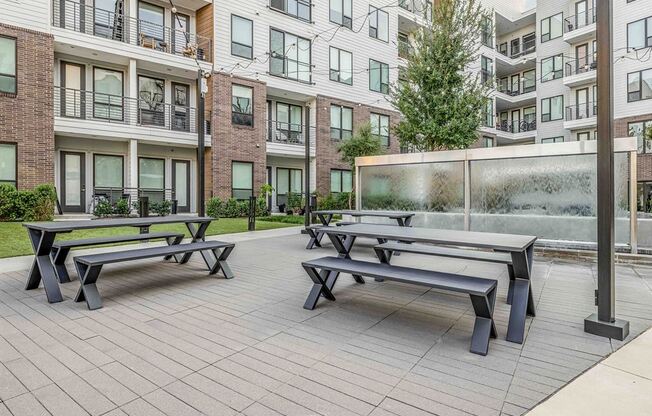 our apartments have a large patio with picnic tables and a water fountain