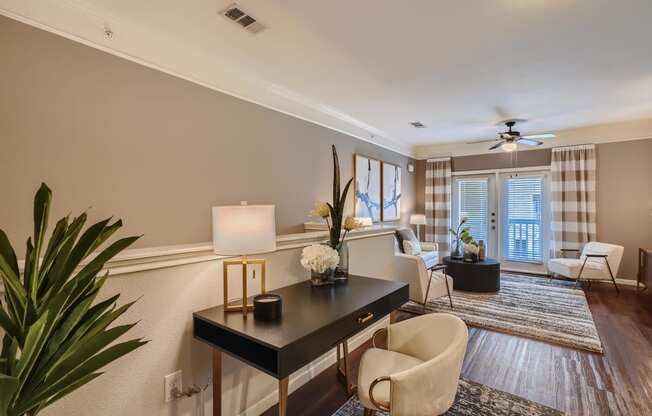 a living room filled with furniture and a table