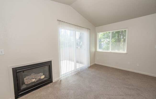 A room with a fireplace and a window with blinds at Autumn Oaks Apartments, Roseville, CA, 95678