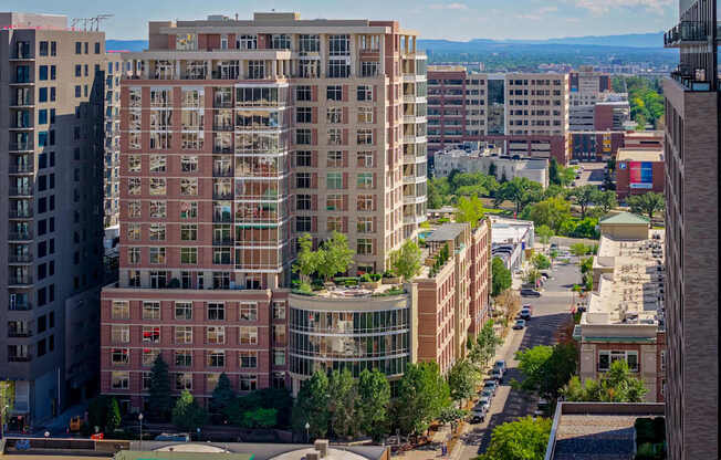 A cityscape with buildings and trees.