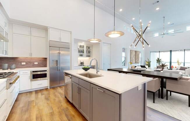 a large kitchen with an island and a dining table