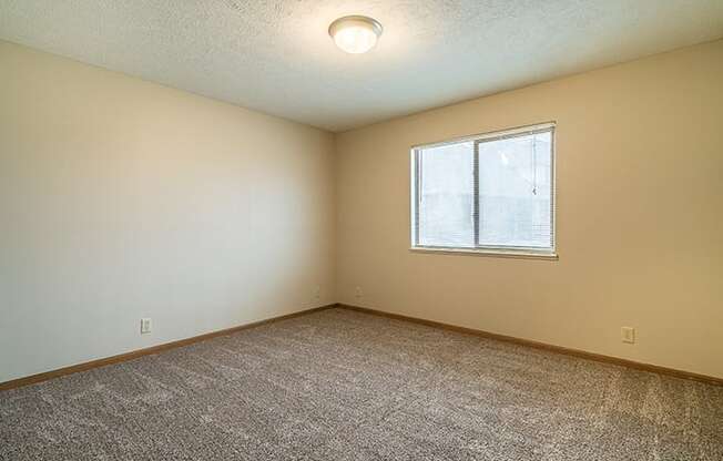 Large bedroom with natural light at Fountain Glen Apartments