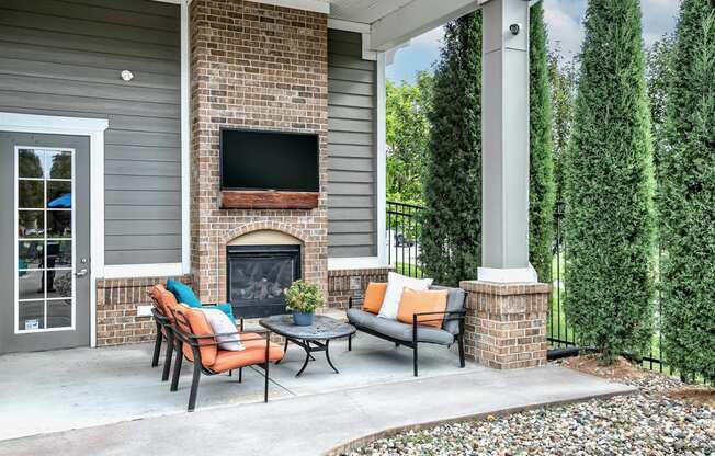 Poolside fireplace and seating area at Legacy Commons Apartments in Omaha, NE
