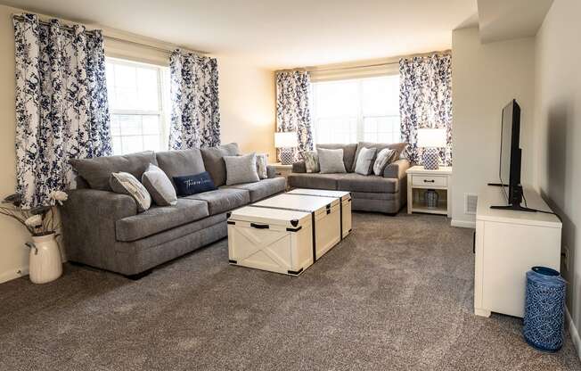 a living room with two couches and a coffee table at Chapel Valley Townhomes, Baltimore, MD 21236