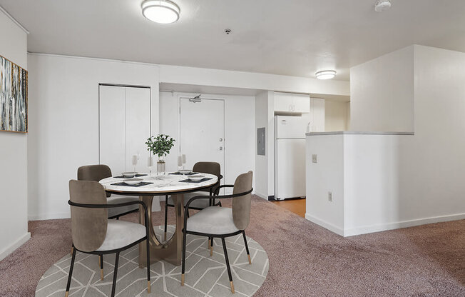 a dining room with a table and chairs