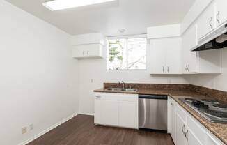 Kitchen with Stainless Steel Appliances and White Cabinets