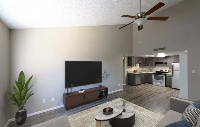 a living room with a flat screen tv and a kitchen