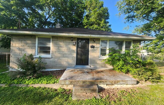 Charming 2 bedroom 1 bath with large rooms and attached carport - unfinished basement!