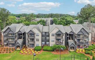the Apartment complex with multiple buildings and landscaped gardens.