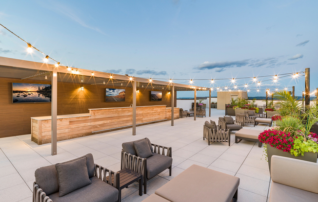 Elevate your entertainment experience with Modera Montville's rooftop deck featuring TVs, where relaxation meets the skyline.