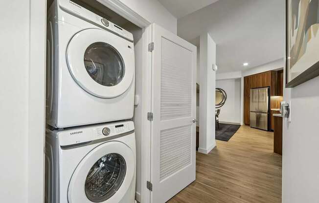 Laundry room with machines at Bayview Apartments, California, 94608