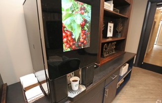 the living room has a tv and a cup of coffee at Century Baxter Avenue, Louisville