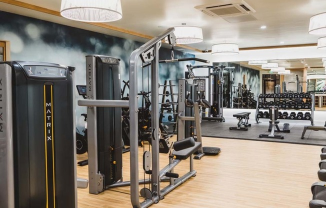 Fitness studio featuring cardio and weight stations