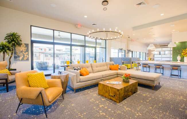 a living room with couches and chairs and a table