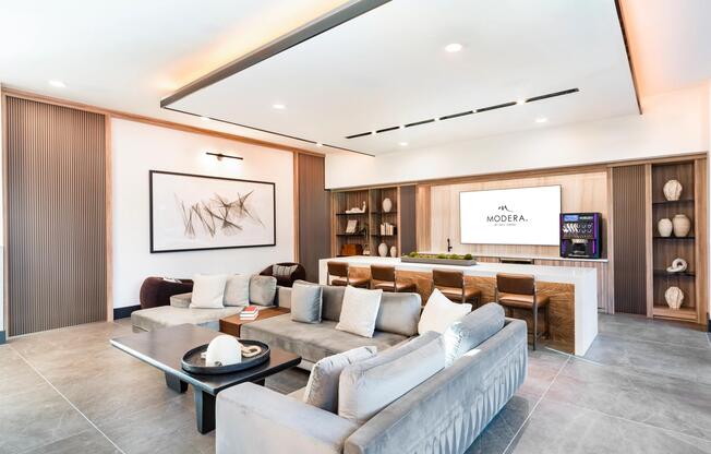 Sleek and inviting, this lounge offers plush seating, a large TV, and a self-serve beverage bar perfect for casual hangs or catching the game.