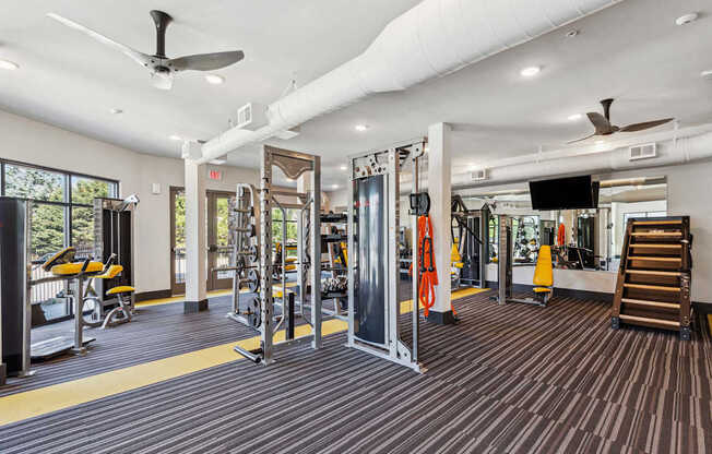 the gym at the enclave at woodbridge apartments in sugar land, tx