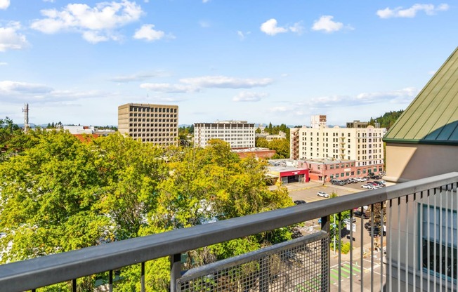 a view of the city from a balcony of a building