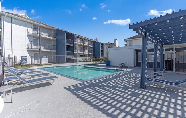 our apartments have a pool and covered area with lounge chairs