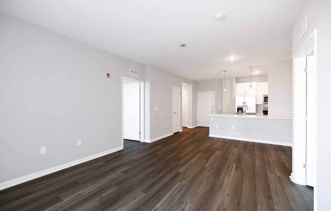 A room with wooden flooring and white walls. at Harbor Pointe, Bayonne, New Jersey