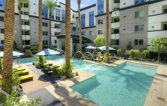 Apartments Phoenix - Level at Sixteenth - Resort-Style Pool with Lounge Chairs and Fountains