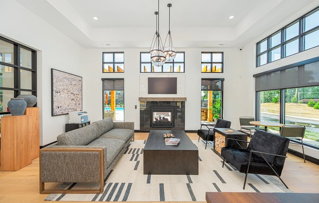 a living room with a couch and a coffee table and a fireplace