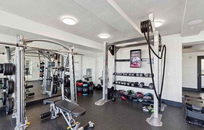 a gym with weights and other equipment in a home