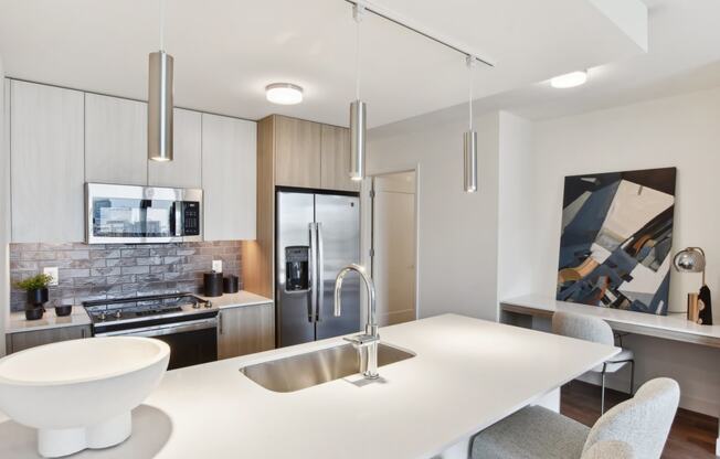 a kitchen with a white counter top and a sink at Cassidy on Canal, Chicago, IL, 60654