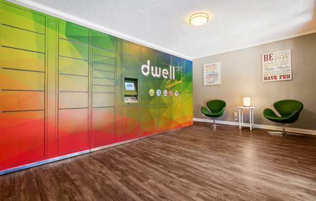 the lobby of a quiet room with chairs and colourful lockers