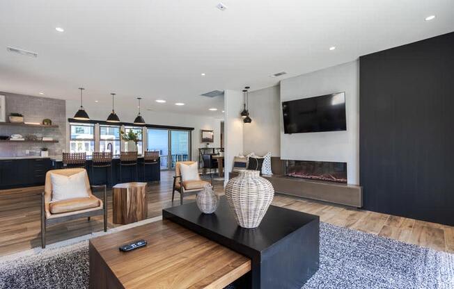 a living room with a fireplace and a television