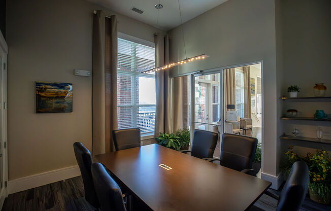 a conference room with a wooden table and chairs