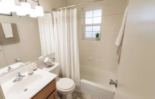 This is a photo of the bathroom of the 1 bedroom, 631 square foot model apartment at Lake of the Woods Apartments in Cincinnati, OH.