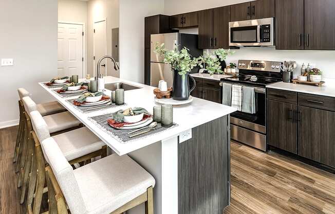 Studio, one two and three bedroom apartments and townhomes featuring open concept floor plans, dens, large windows, stainless steel appliances, quartz countertops, eat-in kitchens, pantries, LVT flooring and much more at The Trails at North Streams in Omaha, NE