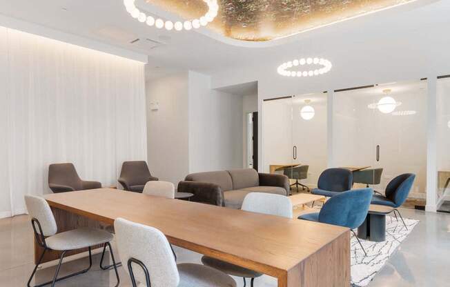 a conference room with a wooden table and chairs