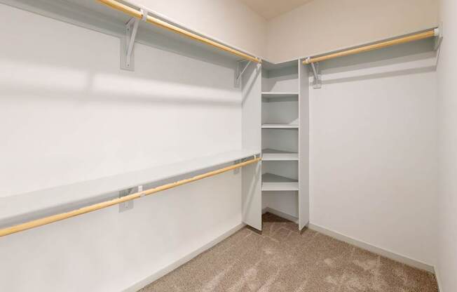 A white wall with a yellow line and a white shelf.