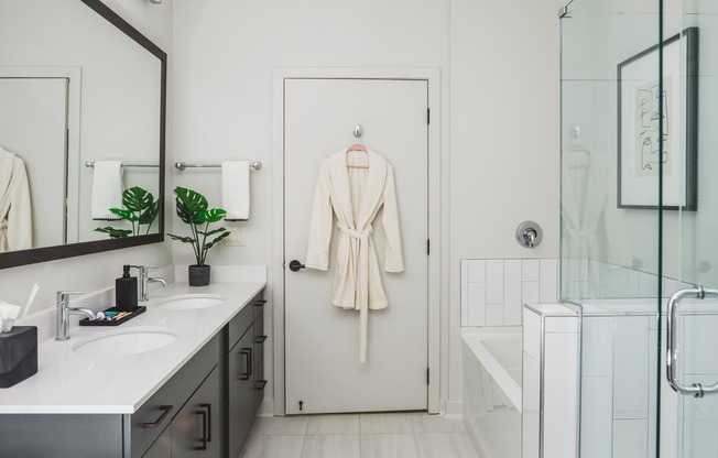 Designer bathrooms with quartz countertops, dual vanities, and soaking tubs