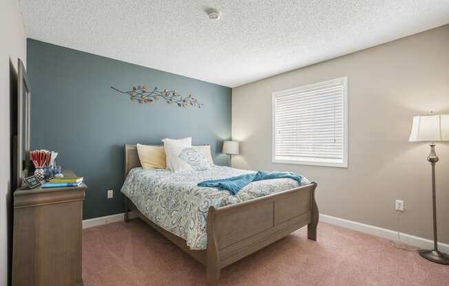Bedroom with a bed and a dresser and a window  at Cape Landing, Myrtle Beach, South Carolina