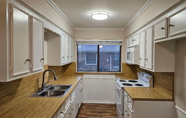 Three bedroom and two bathroom nicely remodeled with new flooring. Large wood fenced backyard