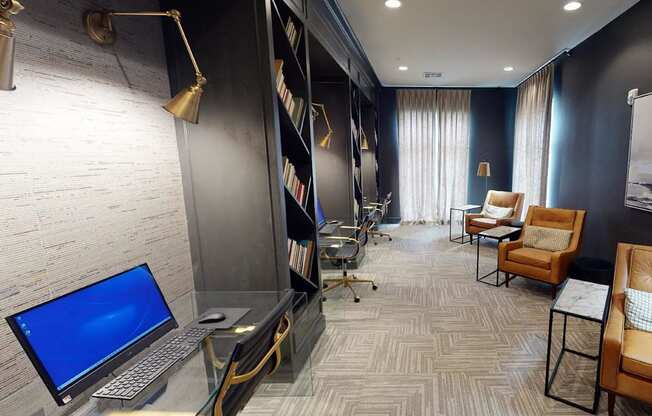 a conference room with a laptop computer on a desk at The Fitzroy San Marcos, San Marcos, Texas