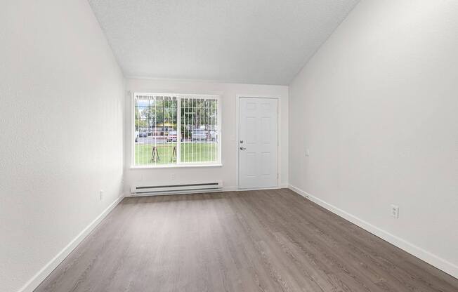 A room with a window and a door.