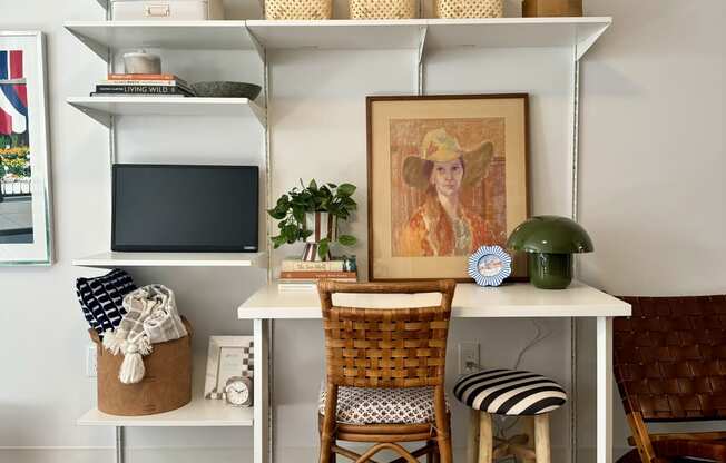 a workspace with a desk and a chair in a living room at The Teale Navy Yard, North Charleston, South Carolina