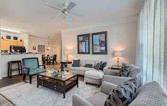 a living room with couches and chairs and a table