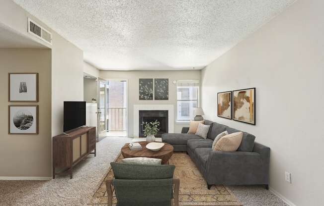 the living room of an apartment with a couch and a coffee table