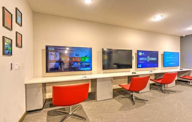 a room with three televisions on the wall  at Fusion, Jacksonville, FL, 32256