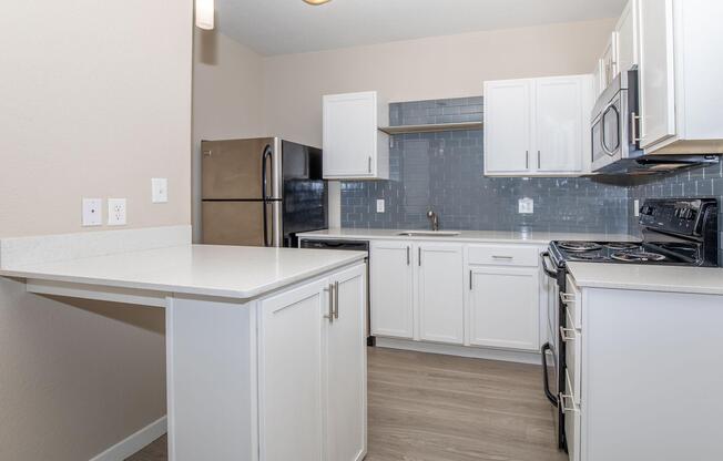 a kitchen with a sink and a refrigerator