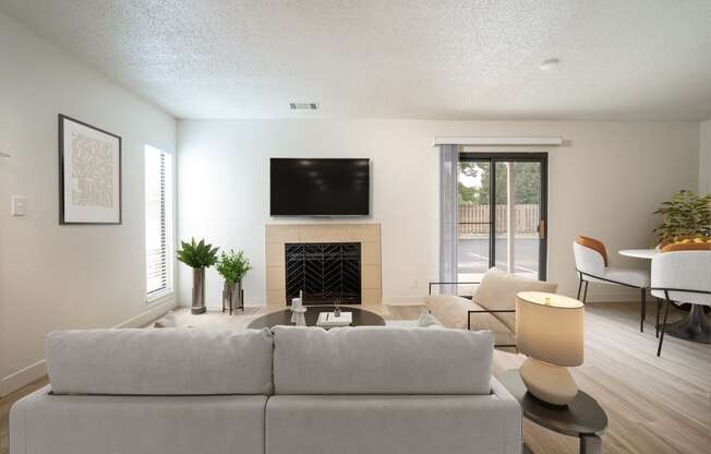 the living room of a house with a couch and a tv