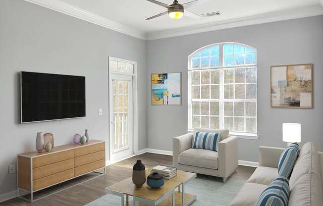 a living room with a ceiling fan and a television