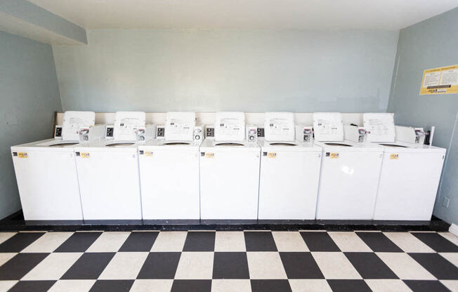 laundry room with black and white tiles