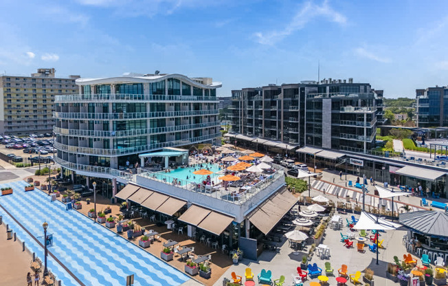 A large outdoor plaza with a pool and seating area.