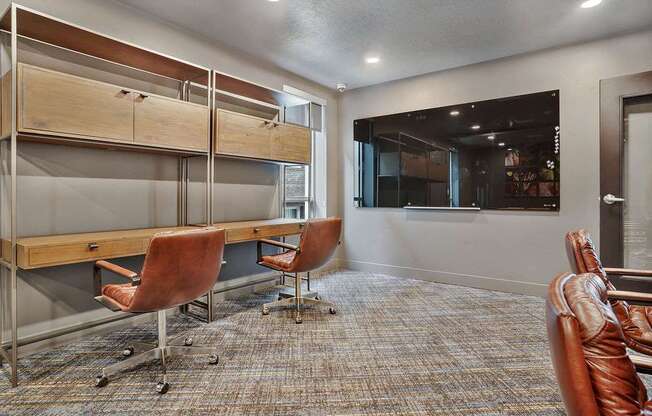 A room with a long table and chairs.