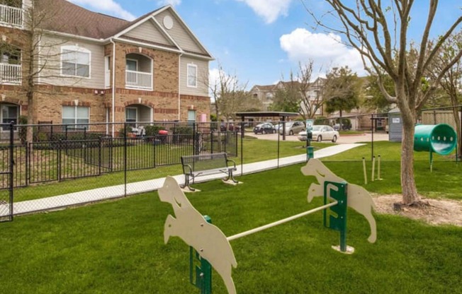 a dog park in front of a house at Carrington at Barker Cypress, Cypress